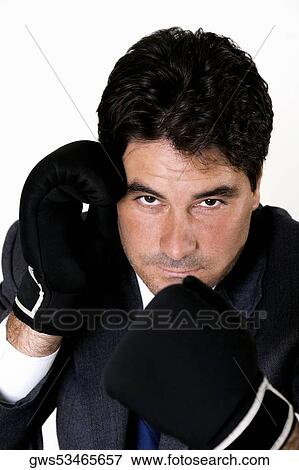 Portrait of a businessman wearing boxing gloves View Large Photo Image Stock Photo - Portrait of a businessman wearing boxing gloves. Fotosearch