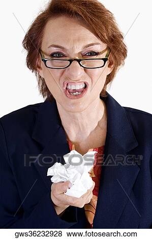 Portrait of a businesswoman crushing paper View Large Photo Image Stock Photo - Portrait of a businesswoman crushing paper. Fotosearch