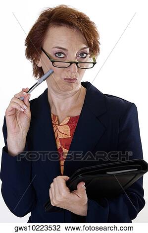 Portrait of a businesswoman holding a pen and a file View Large Photo Image Stock Image - Portrait of a businesswoman holding a pen and a file. Fotosearch