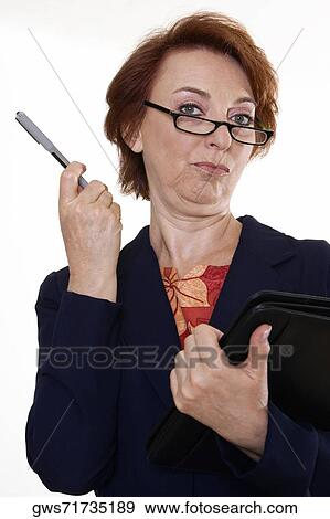 Portrait of a businesswoman holding a file and a pen View Large Photo Image Stock Photo - Portrait of a businesswoman holding a file and a pen. Fotosearch