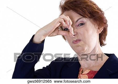 Portrait of a businesswoman holding her nose View Large Photo Image Stock Photography - Portrait of a businesswoman holding her nose. Fotosearch
