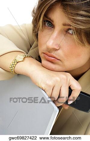 Portrait of a businesswoman leaning on a laptop View Large Photo Image Stock Image - Portrait of a businesswoman leaning on a laptop. Fotosearch
