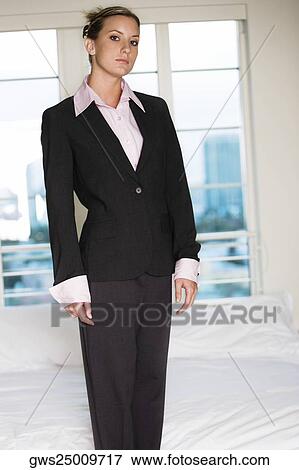 Portrait of a businesswoman standing on the bed View Large Photo Image Stock Photo - Portrait of a businesswoman standing on the bed. Fotosearch