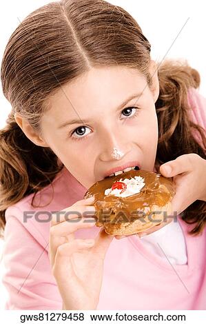 Portrait of a girl eating a donut View Large Photo Image Stock Photo - Portrait of a girl eating a donut. Fotosearch