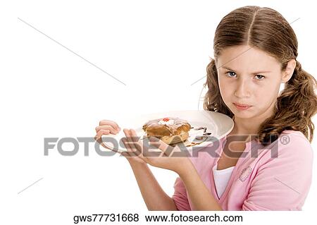 Stock Photo - Portrait of a girl holding a donut in a plate. Fotosearch
