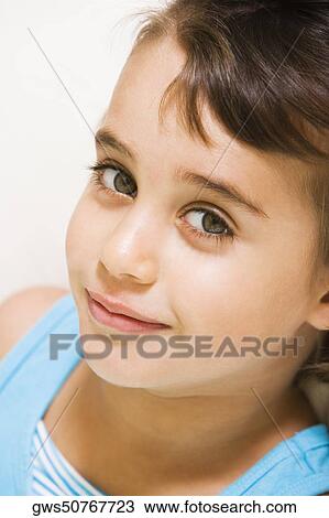 Stock Image - Portrait of a girl smiling. Fotosearch