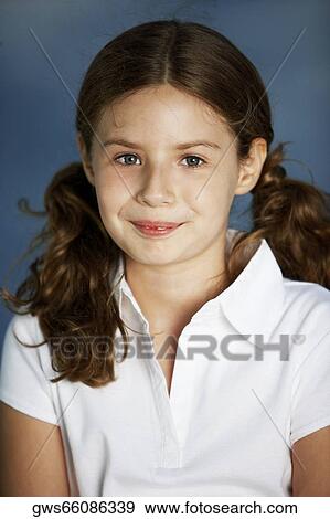 Stock Photo - Portrait of a girl smiling. Fotosearch