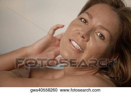 Portrait of a mature woman smiling View Large Photo Image Stock Image - Portrait of a mature woman smiling. Fotosearch