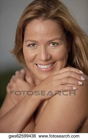 Stock Photograph - Portrait of a mature woman smiling. Fotosearch