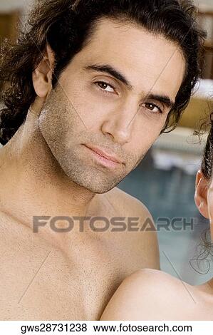 Portrait of a mid adult man and a young woman at the poolside View Large Photo Image Stock Photo - Portrait of a mid adult man and a young woman at the poolside. Fotosearch