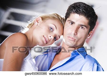 Portrait of a mid adult man and a young woman View Large Photo Image Stock Photograph - Portrait of a mid adult man and a young woman. Fotosearch