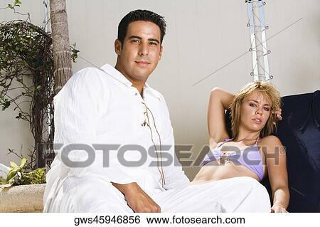 Portrait of a mid adult man and a young woman View Large Photo Image Stock Photograph - Portrait of a mid adult man and a young woman. Fotosearch