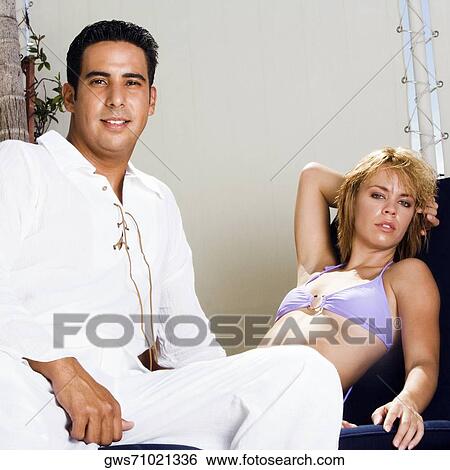 Portrait of a mid adult man and a young woman View Large Photo Image Stock Photograph - Portrait of a mid adult man and a young woman. Fotosearch