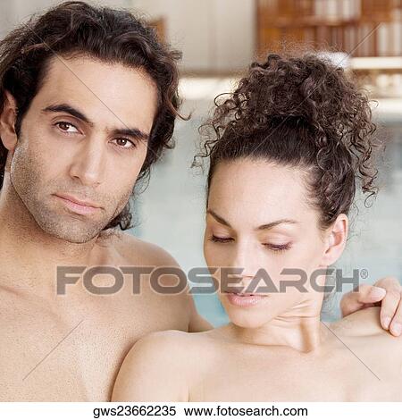 Portrait of a mid adult man and a young woman at the poolside View Large Photo Image Stock Photography - Portrait of a mid adult man and a young woman at the poolside. Fotosearch