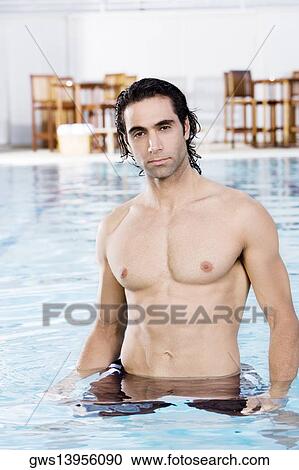 Portrait of a mid adult man in a swimming pool View Large Photo Image Stock Image - Portrait of a mid adult man in a swimming pool. Fotosearch