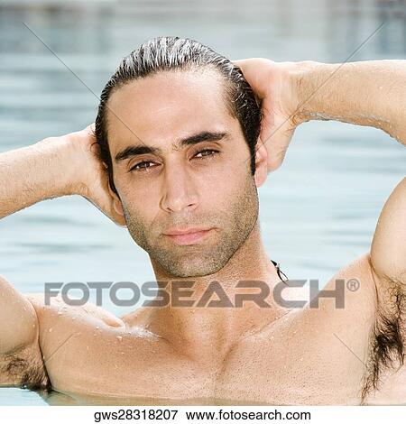 Portrait of a mid adult man in a swimming pool View Large Photo Image Stock Photo - Portrait of a mid adult man in a swimming pool. Fotosearch