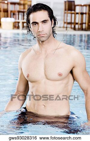 Portrait of a mid adult man in a swimming pool View Large Photo Image Stock Photograph - Portrait of a mid adult man in a swimming pool. Fotosearch