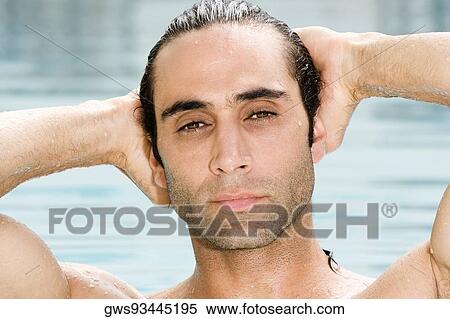 Portrait of a mid adult man in a swimming pool View Large Photo Image Stock Photography - Portrait of a mid adult man in a swimming pool. Fotosearch
