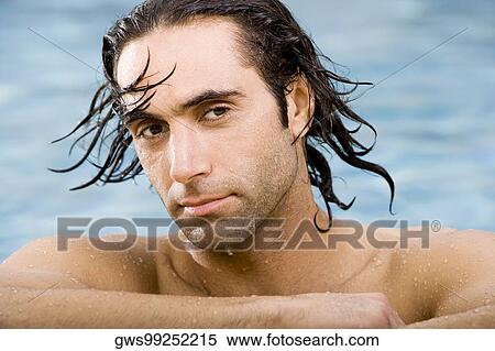 Portrait of a mid adult man in a swimming pool View Large Photo Image Stock Photography - Portrait of a mid adult man in a swimming pool. Fotosearch