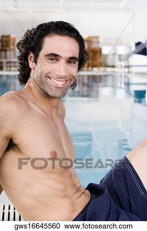 Portrait of a mid adult man sitting at the poolside View Large Photo Image Stock Image - Portrait of a mid adult man sitting at the poolside. Fotosearch