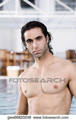 Portrait of a mid adult man standing in a swimming pool View Large Photo Image Stock Photo - Portrait of a mid adult man standing in a swimming pool. Fotosearch