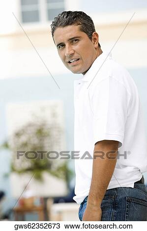 Stock Image - Portrait of a mid adult man standing. Fotosearch