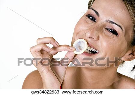 Portrait of a mid adult woman biting a condom View Large Photo Image Stock Image - Portrait of a mid adult woman biting a condom. Fotosearch