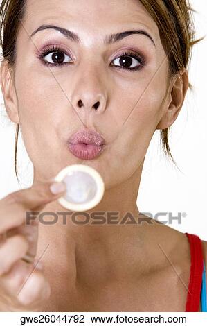 Portrait of a mid adult woman blowing a condom View Large Photo Image Stock Image - Portrait of a mid adult woman blowing a condom. Fotosearch