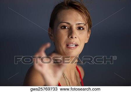 Portrait of a mid adult woman making an ok gesture View Large Photo Image Stock Image - Portrait of a mid adult woman making an ok gesture. Fotosearch