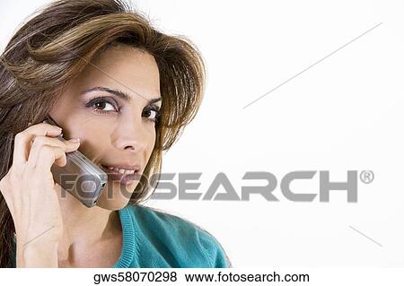 Portrait of a mid adult woman talking on a mobile phone View Large Photo Image Stock Photo - Portrait of a mid adult woman talking on a mobile phone. Fotosearch