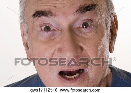 Portrait of a senior man looking shocked View Large Photo Image Stock Photo - Portrait of a senior man looking shocked. Fotosearch