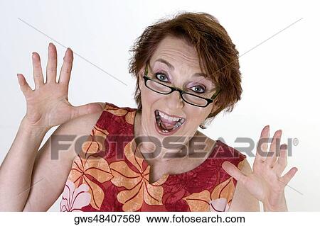 Portrait of a senior woman making a face View Large Photo Image Stock Photo - Portrait of a senior woman making a face. Fotosearch
