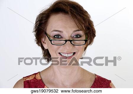 Portrait of a senior woman smiling View Large Photo Image Stock Image - Portrait of a senior woman smiling. Fotosearch