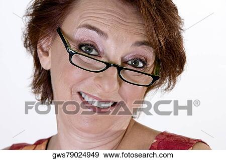 Portrait of a senior woman smiling View Large Photo Image Stock Photo - Portrait of a senior woman smiling. Fotosearch