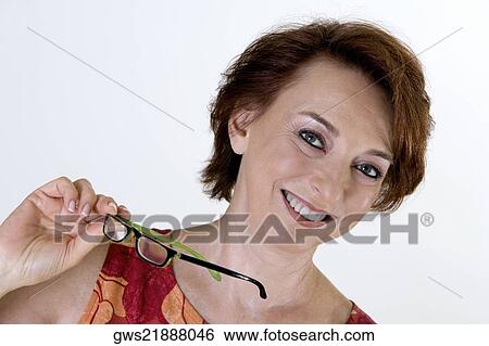 Portrait of a senior woman smiling View Large Photo Image Stock Photograph - Portrait of a senior woman smiling. Fotosearch