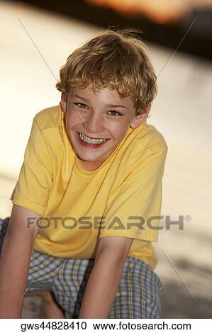 Portrait of a teenage boy smiling View Large Photo Image Stock Image - Portrait of a teenage boy smiling. Fotosearch