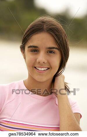 Portrait of a teenage girl smiling View Large Photo Image Picture - Portrait of a teenage girl smiling. Fotosearch