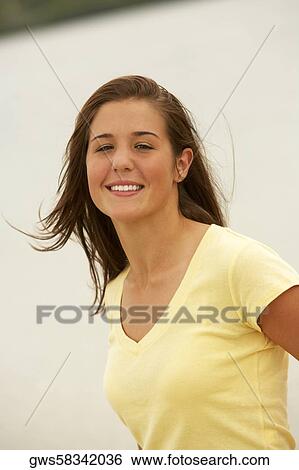 Stock Photograph - Portrait of a teenage girl smiling. Fotosearch