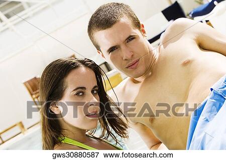 Portrait of a young couple at the poolside View Large Photo Image Stock Photo - Portrait of a young couple at the poolside. Fotosearch