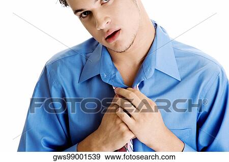 Portrait of a young man adjusting his tie View Large Photo Image Stock Photo - Portrait of a young man adjusting his tie. Fotosearch