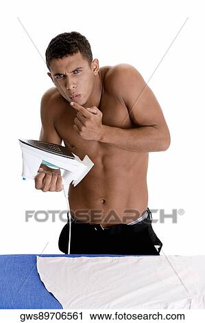 Portrait of a young man blowing his burnt finger View Large Photo Image Stock Image - Portrait of a young man blowing his burnt finger. Fotosearch