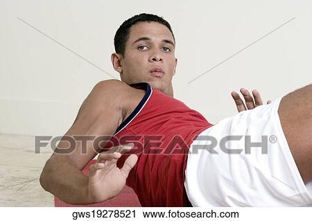 Portrait of a young man exercising View Large Photo Image Stock Image - Portrait of a young man exercising. Fotosearch