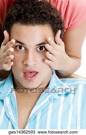 Portrait of a young man getting his face rubbed by a young woman View Large Photo Image Stock Image - Portrait of a young man getting his face rubbed by a young woman. Fotosearch