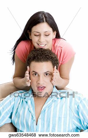 Portrait of a young man getting his face rubbed by a young woman View Large Photo Image Stock Photo - Portrait of a young man getting his face rubbed by a young woman. Fotosearch