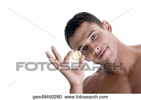 Portrait of a young man holding a condom View Large Photo Image Stock Image - Portrait of a young man holding a condom. Fotosearch