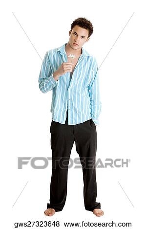 Portrait of a young man holding a flower View Large Photo Image Stock Photo - Portrait of a young man holding a flower. Fotosearch