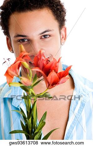 Portrait of a young man holding flowers View Large Photo Image Stock Photo - Portrait of a young man holding flowers. Fotosearch