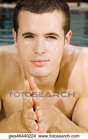 Portrait of a young man in a swimming pool View Large Photo Image Picture - Portrait of a young man in a swimming pool. Fotosearch