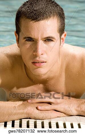 Portrait of a young man in a swimming pool View Large Photo Image Stock Image - Portrait of a young man in a swimming pool. Fotosearch