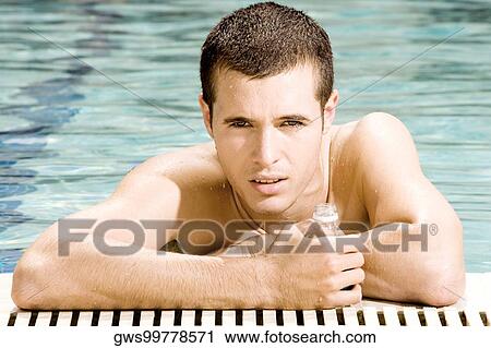 Portrait of a young man in a swimming pool View Large Photo Image Stock Image - Portrait of a young man in a swimming pool. Fotosearch